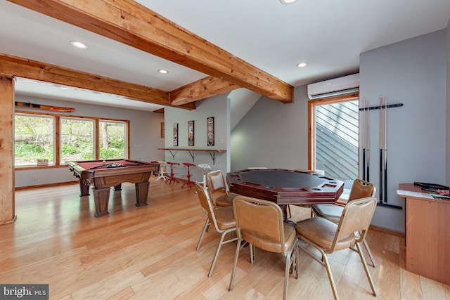 game room featuring beam ceiling, light wood-type flooring, pool table, and a wall mounted AC