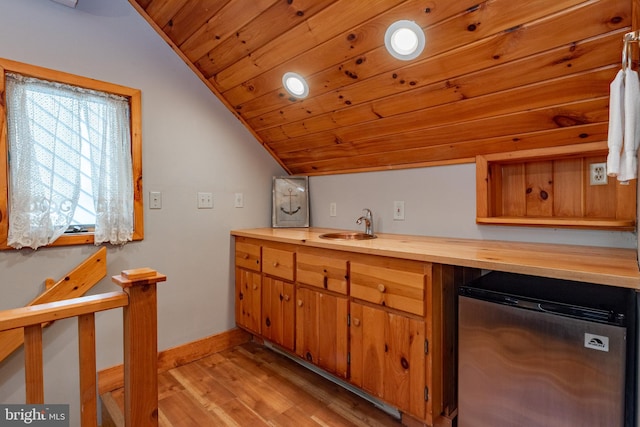 kitchen with stainless steel fridge, wood ceiling, sink, light hardwood / wood-style flooring, and lofted ceiling