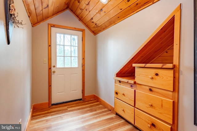 doorway to outside featuring wooden ceiling, lofted ceiling, and light hardwood / wood-style floors