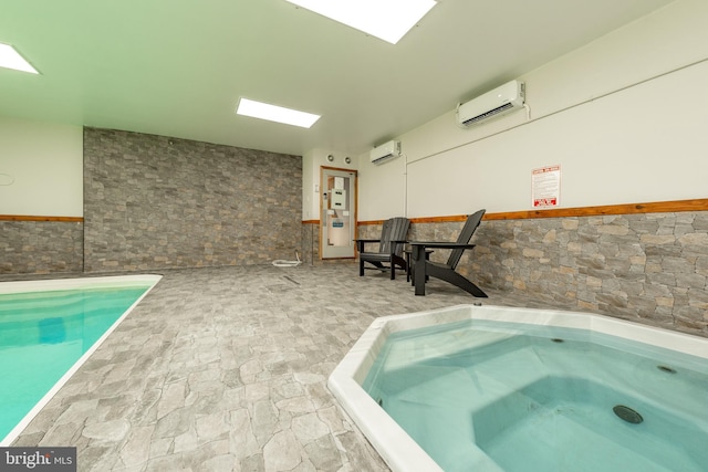 view of pool with a wall mounted air conditioner and an indoor hot tub