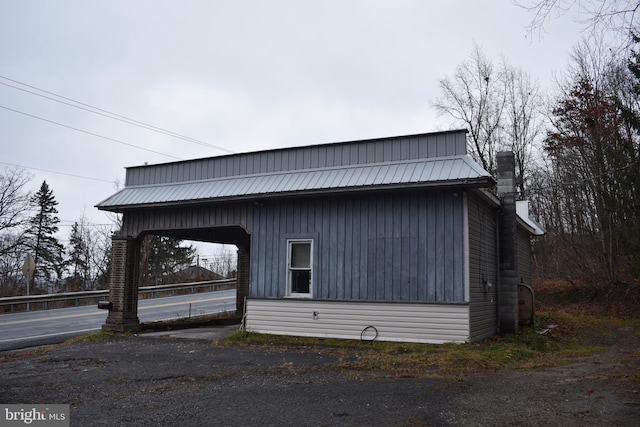 view of home's exterior featuring a carport