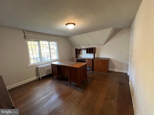 home office featuring lofted ceiling, radiator, and dark wood-type flooring