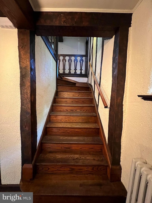 staircase featuring radiator