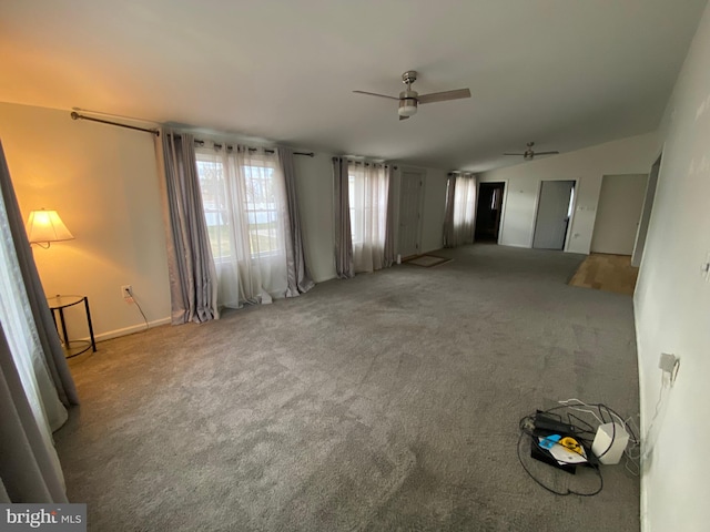 unfurnished room featuring ceiling fan and carpet