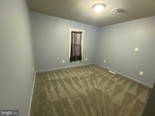 spare room with carpet floors