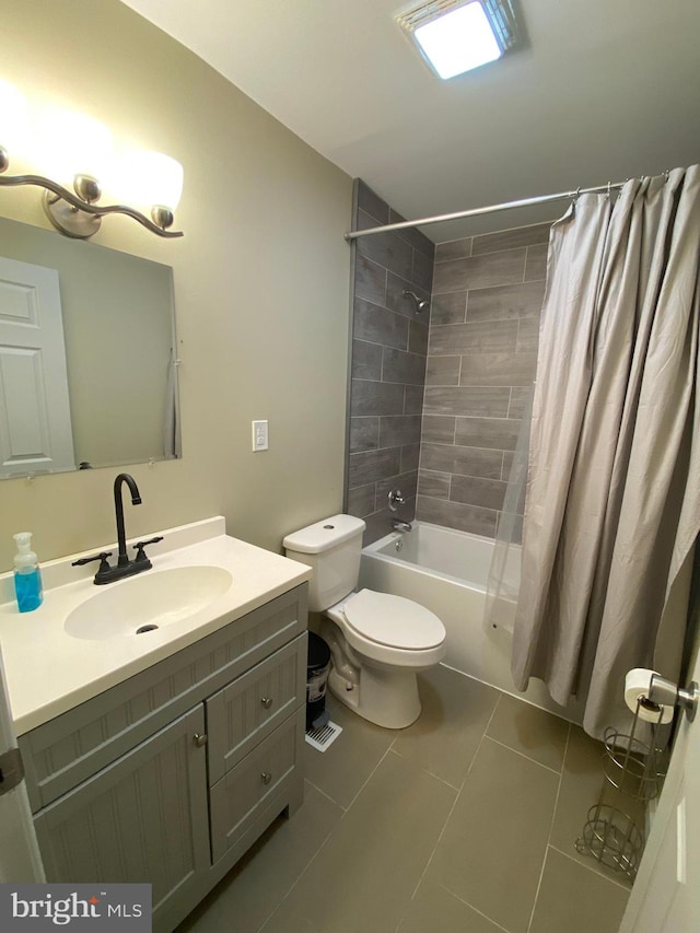 full bathroom with tile patterned floors, vanity, shower / bath combo, and toilet