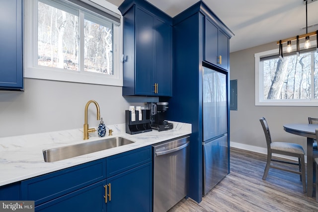 kitchen with light hardwood / wood-style floors, sink, blue cabinets, and stainless steel appliances