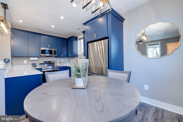 dining space featuring dark hardwood / wood-style floors and a wealth of natural light