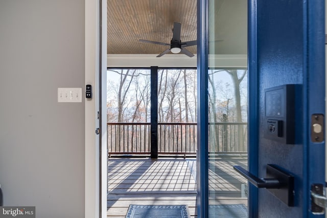 entryway featuring ceiling fan, plenty of natural light, wood-type flooring, and wooden ceiling