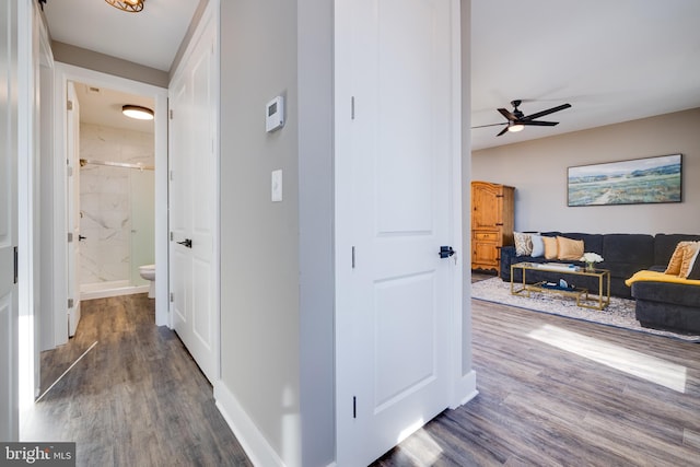 hall with dark hardwood / wood-style floors