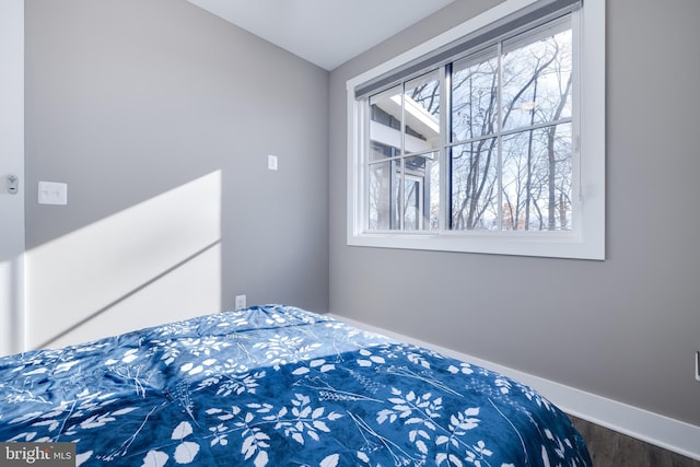 bedroom with hardwood / wood-style flooring