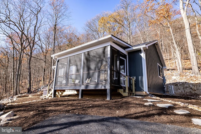 view of front facade with a sunroom