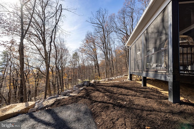 view of yard with a sunroom