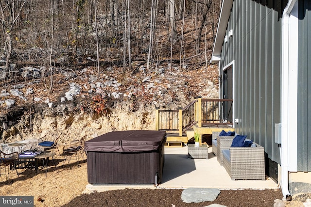 view of patio with a grill and a hot tub