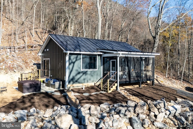 view of outdoor structure featuring a sunroom