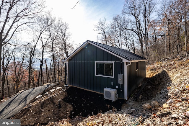 view of outbuilding featuring ac unit