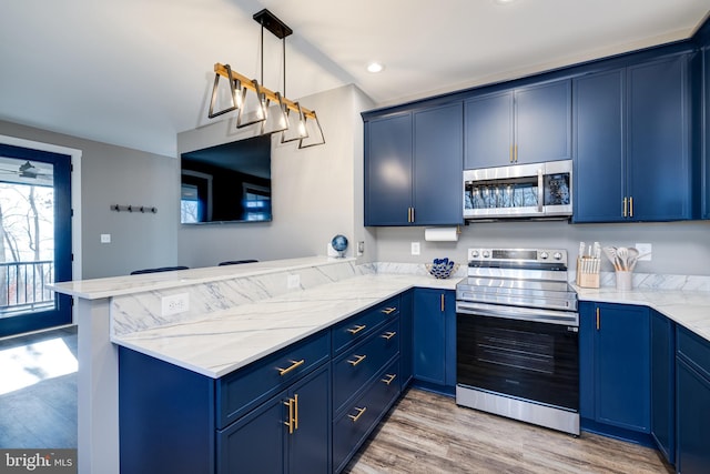 kitchen with blue cabinetry, hanging light fixtures, stainless steel appliances, kitchen peninsula, and light hardwood / wood-style floors