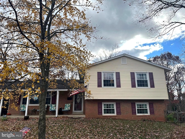 tri-level home with a patio