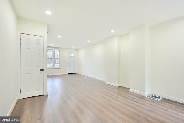 empty room featuring dark hardwood / wood-style flooring