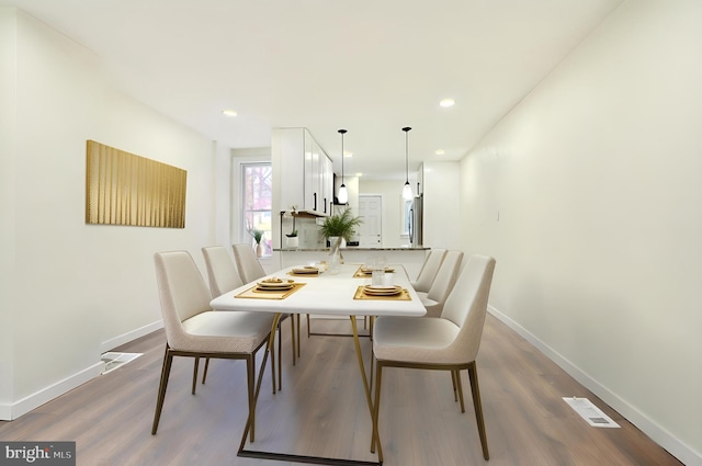 dining room featuring hardwood / wood-style flooring