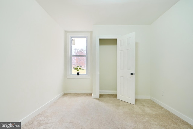 unfurnished bedroom featuring light colored carpet