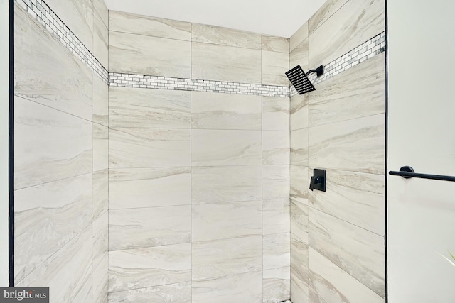 bathroom with tiled shower