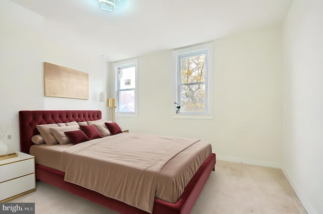 bedroom with light carpet