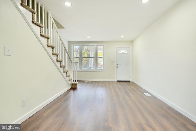 foyer entrance featuring dark hardwood / wood-style flooring