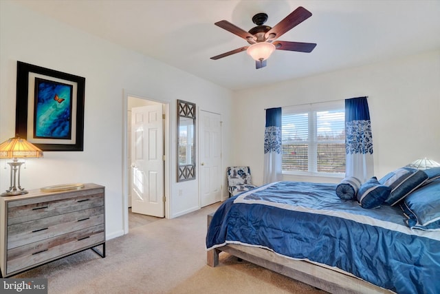 carpeted bedroom featuring ceiling fan