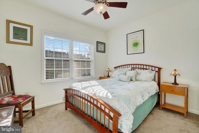 bedroom featuring ceiling fan and light colored carpet