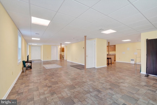 basement featuring a drop ceiling