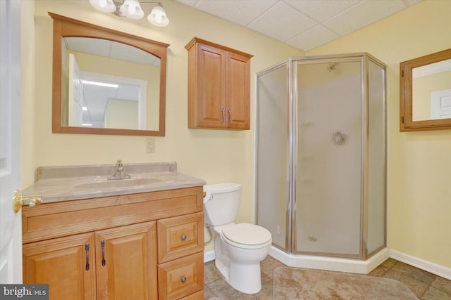 bathroom with toilet, vanity, tile patterned floors, and an enclosed shower