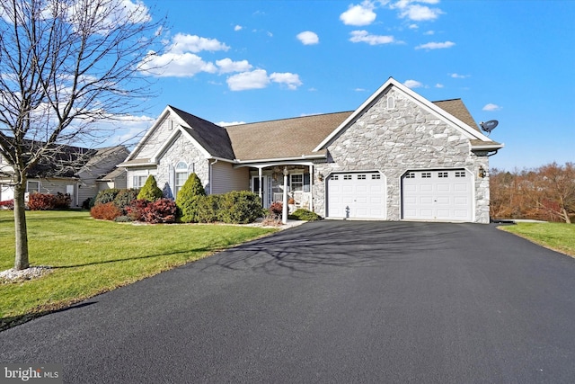 view of front of house with a front lawn and a garage