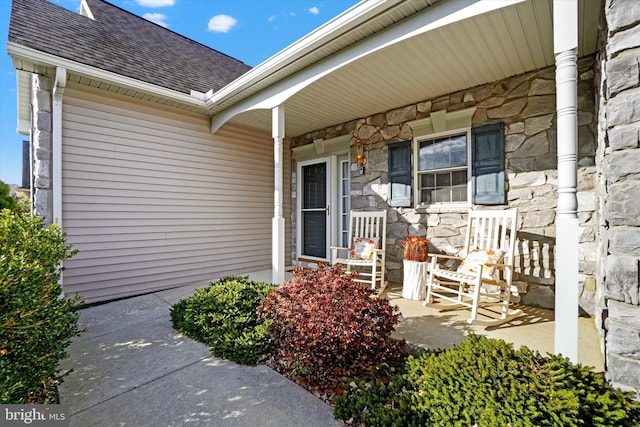 property entrance featuring covered porch