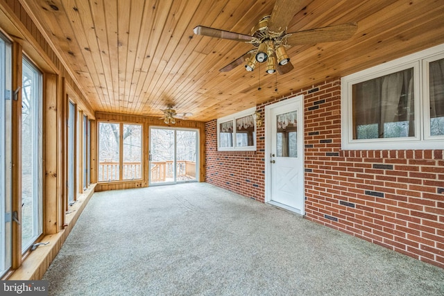 unfurnished sunroom featuring wood ceiling