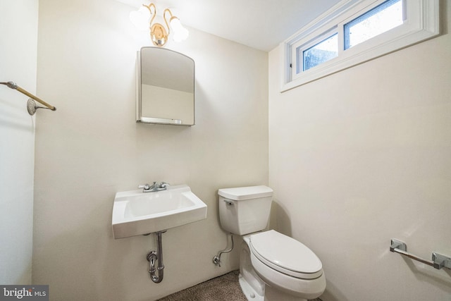 bathroom featuring sink and toilet