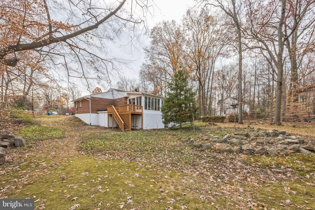 view of yard with a wooden deck