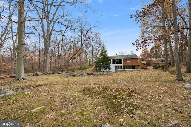 view of yard featuring a wooden deck