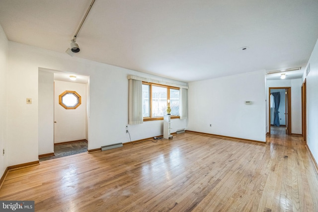 unfurnished living room with light wood-type flooring