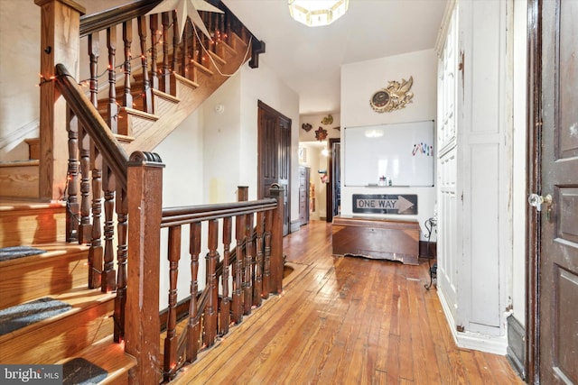 hallway with light hardwood / wood-style flooring