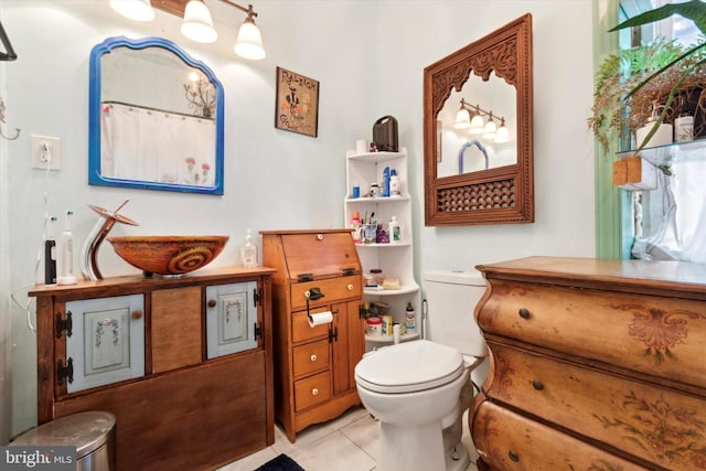 bathroom featuring tile patterned floors and toilet