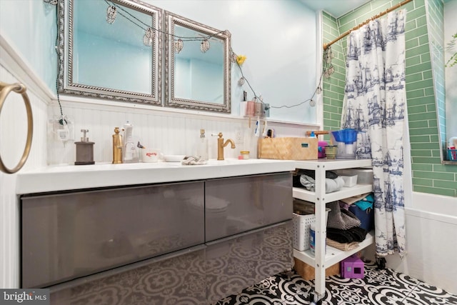 bathroom with shower / bath combo and vanity