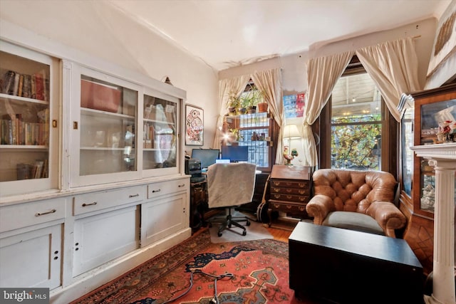 home office with wood-type flooring