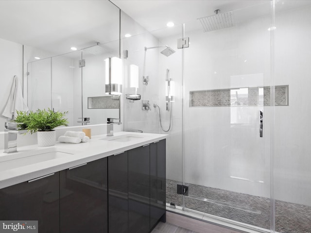 bathroom with vanity and an enclosed shower