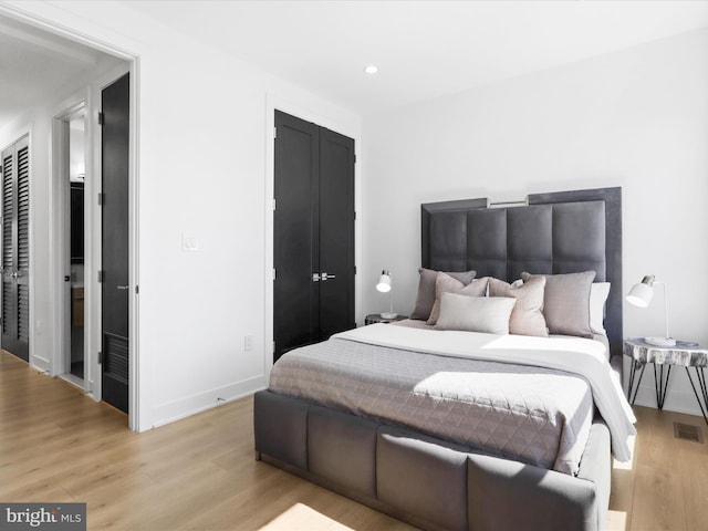 bedroom featuring light wood-type flooring