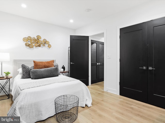 bedroom with light hardwood / wood-style flooring