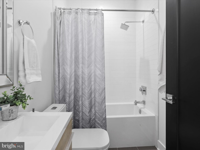 full bathroom featuring shower / tub combo with curtain, vanity, and toilet