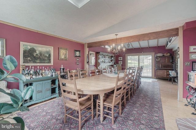 dining room featuring light hardwood / wood-style floors, lofted ceiling with beams, a textured ceiling, and an inviting chandelier