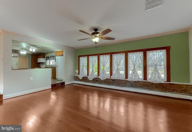 unfurnished living room featuring ceiling fan, hardwood / wood-style floors, and ornamental molding