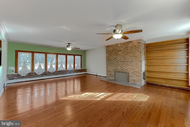 unfurnished living room featuring ceiling fan, a baseboard radiator, light hardwood / wood-style flooring, a fireplace, and ornamental molding